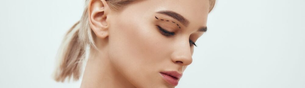 blonde woman with sketch on her face